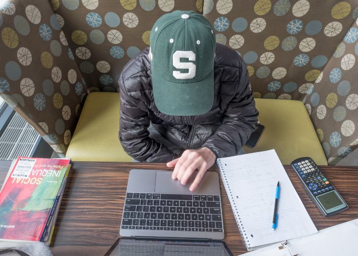 MSU student studying in a study lounge. 